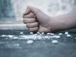Person in Albany going through drug addiction